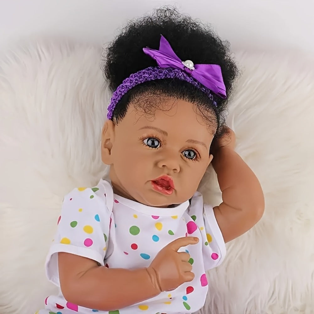 Reborn Baby Doll 21.5-Inch Full Vinyl Design with Curly Dark Hair, Open Eyes and Purple-and-White Outfit