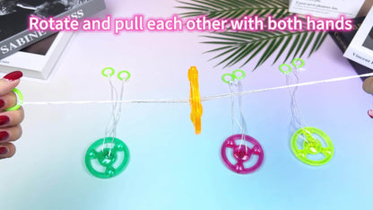 Thirty Pull-String Flywheel Spinner Toys with Four Assorted Colors and Pictured 7cm Wheel Diameter