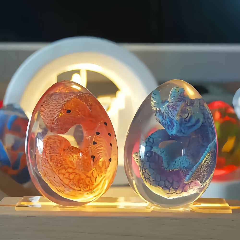 Transparent Dragon Egg Figurine in Red or Green with Oval Resin-Style Display Form Pictured