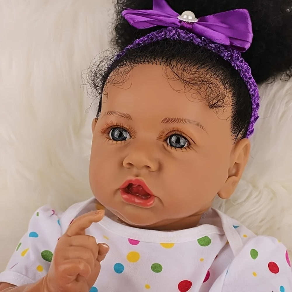 Reborn Baby Doll 21.5-Inch Full Vinyl Design with Curly Dark Hair, Open Eyes and Purple-and-White Outfit