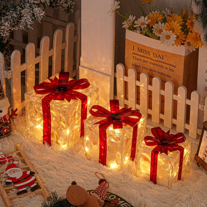 Three Warm-White Light-Up Christmas Gift Boxes with Red Bows, USB Lead and Battery Case Pictured