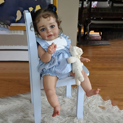Reborn Baby Doll 48cm Soft Vinyl Toddler Design with Curly Dark Hair, Open Eyes and Blue Outfit