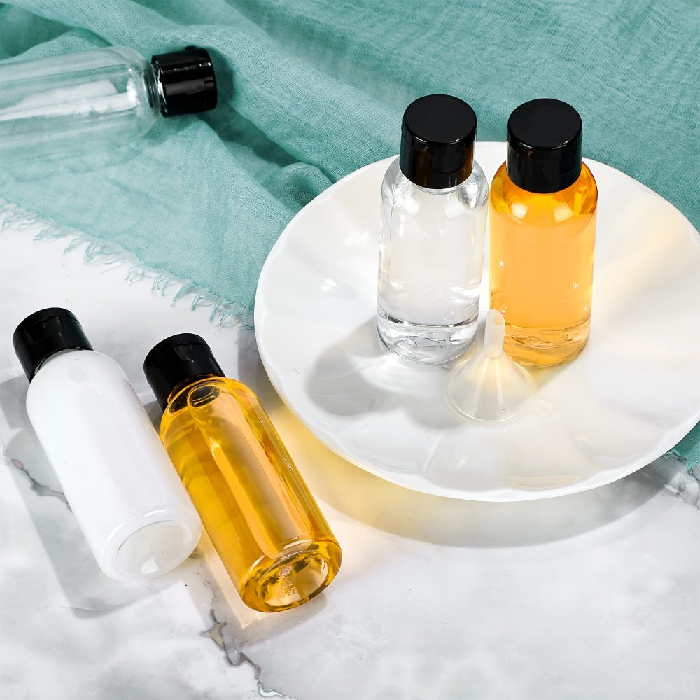 One Hundred Clear 2-Ounce Squeeze Bottles with Black Flip Caps and Two Pictured Filling Funnels