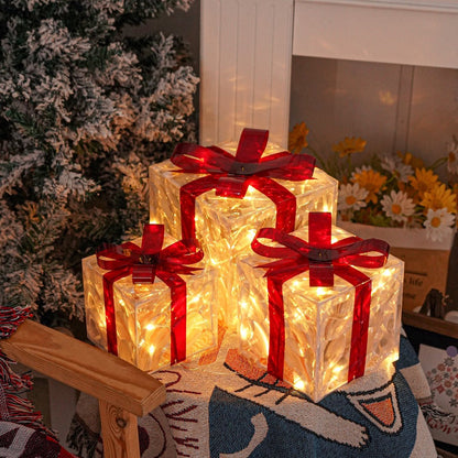 Three Warm-White Light-Up Christmas Gift Boxes with Red Bows, USB Lead and Battery Case Pictured