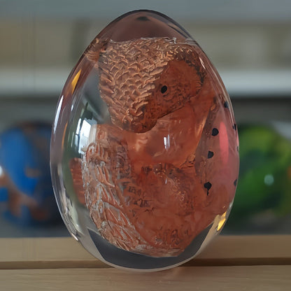 Transparent Dragon Egg Figurine in Red or Green with Oval Resin-Style Display Form Pictured