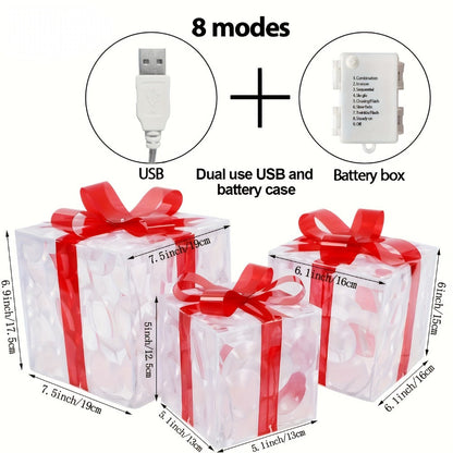Three Warm-White Light-Up Christmas Gift Boxes with Red Bows, USB Lead and Battery Case Pictured