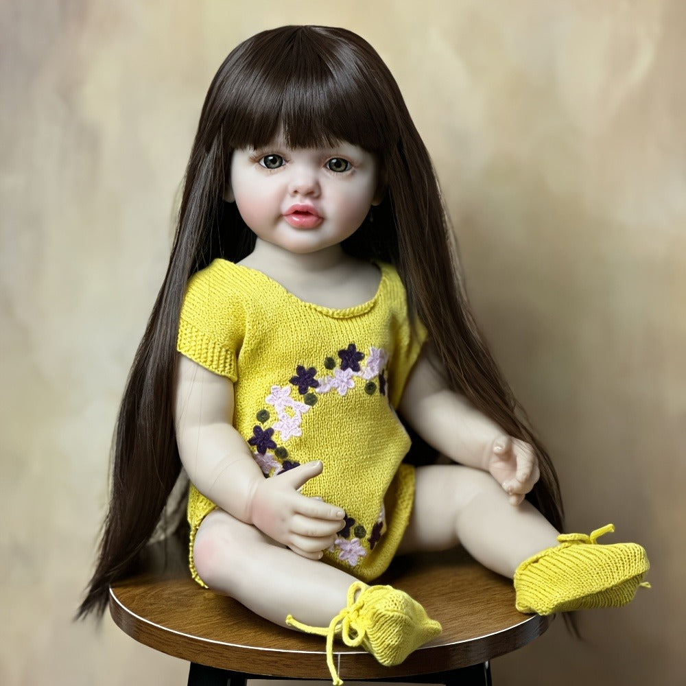 Reborn Baby Doll 22-Inch Full Vinyl Toddler Design with Dark Wig Hair, Acrylic Eyes, Yellow Outfit and Accessories