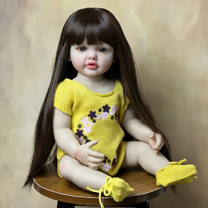 Reborn Baby Doll 22-Inch Full Vinyl Toddler Design with Dark Wig Hair, Acrylic Eyes, Yellow Outfit and Accessories