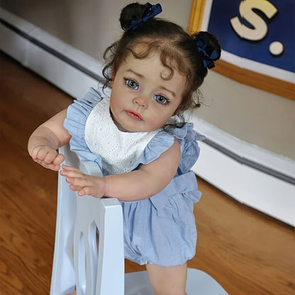 Reborn Baby Doll 48cm Soft Vinyl Toddler Design with Curly Dark Hair, Open Eyes and Blue Outfit