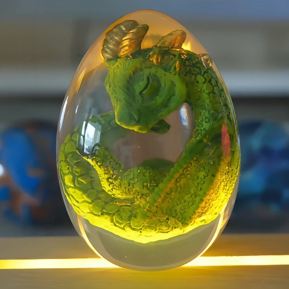 Transparent Dragon Egg Figurine in Red or Green with Oval Resin-Style Display Form Pictured