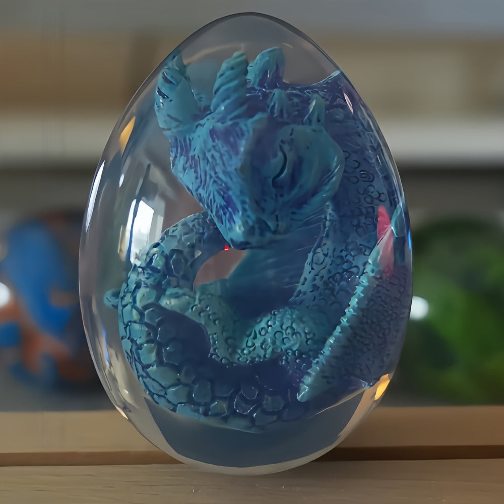 Transparent Dragon Egg Figurine in Red or Green with Oval Resin-Style Display Form Pictured
