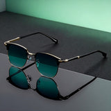 Golden frame with gray-green gradient lenses